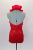 Rich red sequin mesh halter-neck leotard features with a satin ruffle trimming the neck. Leotard is lined and comes with hair accessory. Back