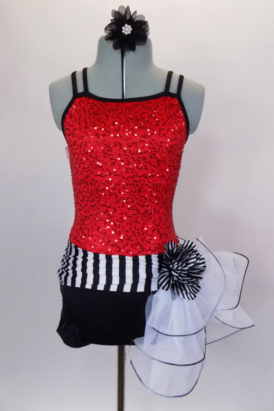 Biketard has red sequin bodice with black double cross straps,. Accented with black & white stripe waistband, large white curly side bustle, attached black shorts & hair accessory. Front