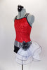 Biketard has red sequin bodice with black double cross straps,. Accented with black & white stripe waistband, large white curly side bustle, attached black shorts & hair accessory. Left side