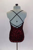 Classy red sequined tunic dress has black cross straps that dips into criss-cross  accent. The front comes to a point with center slit to create an elegant look. Comes with attached spandex briefs. Back