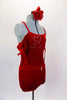 Red velvet leotard has off shoulder gather sleeves with ties & velvet shoulder straps. Bodice has three crystal hearts. Comes with shorts and hair accessory. Side