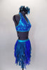 Costume is a halter neck, open back half top with splashes of blue-green & crystals. Bottom is brief with skirt of dangling mesh swirls. Has hair accessory. Right side