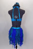 Costume is a halter neck, open back half top with splashes of blue-green & crystals. Bottom is brief with skirt of dangling mesh swirls. Has hair accessory. Back