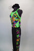 Full unitard has green cross-back tank with colored pattern. The bottom is black  with colored ladder pattern down one leg. Comes with black hat accessory. Left side