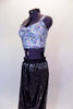 White holographic speckled half-top sits below long sleeved black mesh crop top. Accompanying holographic harem pants have bold letters. Comes with hair tie. Side with no mesh crop top