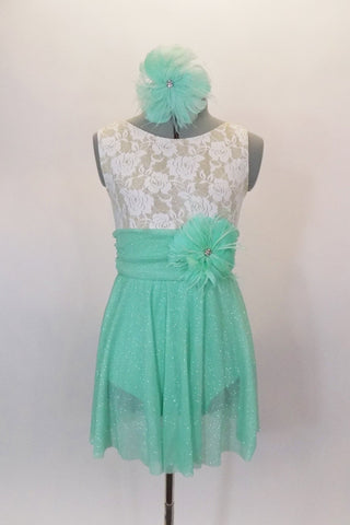 Empire waist dress has ivory lace bodice & shirred cummerbund with feather accent. Skirt is layers of mint green glitter mesh. Has matching hair accessory. Front
