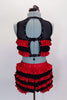 Two-piece costume has layers of red and black ruffles. The half top has three back straps for closure & black mesh upper with crystals to match ruffles bottom. Comes with floral hair accessory. Back