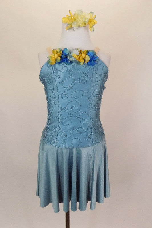 Saddened blue lyrical dress has princess cut bodice with textured paisley swirls and faded flower blossoms on bust. Comes with matching hair accessory. Front
