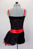 Black, sequined sheer bustier bodice with red stripe accents sits over red metallic bra, Attached black shorts have red waistband & tulle/mesh side bustle. Comes with matching hair accessory. Back