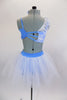 Blue 2-piece costume has unique bra covered on one side with white lace & cascaded in blue daisies & crystals. Skirt is layered white tulle with daisies. Comes with matching hair accessories. Back