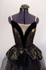 Gold camisole leotard with black sequined lace has wide black velvet deep plunge center with nude insert. Matching overlay sits on long black tulle skirt.  Comes with hair accessory. Front zoomed