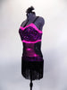 Flapper style dress has black glitter fringe with hot pink sequined waistband, banding & bust. The back is speckled mesh. Comes with hair accessory. Left side