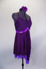 Eggplant dress has leotard base with cross straps & fine pleated gold-flecked bodice with pinch front. Dress has purple metallic band below the empire waist. Comes with floral hair accessory. Side