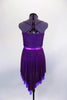 Eggplant dress has leotard base with cross straps & fine pleated gold-flecked bodice with pinch front. Dress has purple metallic band below the empire waist. Comes with floral hair accessory. Back