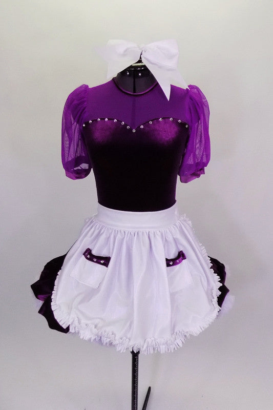Purple velvet dress has sweetheart neckline with mesh upper, sleeves & white fluffy petticoat. The dress comes with a shiny white apron with pockets & hair bow. Front