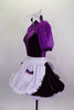 Purple velvet dress has sweetheart neckline with mesh upper, sleeves & white fluffy petticoat. The dress comes with a shiny white apron with pockets & hair bow. Left side