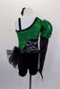 Green sequined asymmetrical one sleeve costume with pouf & lace. One side is cut-out with black lace. Black velvet shorts have sequined bow ruffle accent on hip. Comes with hair accessory. Back