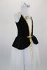 Black & white romantic tutu dress has skirt in layers of white tulle. The black velvet peplum bodice has white center panel with applique & gold braid accent. Comes with matching hair accessory. Right side