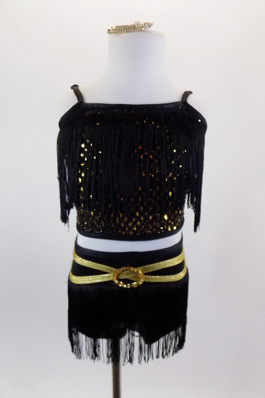 Black & gold 2-piece costume has open back half top with black fringe. The  briefs have fringe on hip & gold belt. Comes with gold and crystal hair accessory. Front