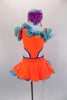 Bright orange velvet one-shoulder dress has open sides with purple crystals. Curly hem ruffles in lime, turquoise & purple accent the neckline & petticoat edge. Comes with ruffled gauntlets and floral headband. Front