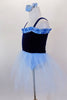 Dark blue velvet ballet dress with pale blue ruffle accent at neckline has attached pale blue tulle skirt &  panty. Comes with pale blue hair accessory. Side