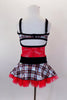Red, black & silver tartan school-girl costume has tartan bust and skirt attached by red sequined lace torso with crystaled black velvet center and waistband. Comes with crystal air barrette. Back