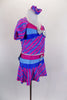 2-piece, purple-pink stripe costume with silver fleck, has pouf sleeve top. Bust and waist have bands of periwinkle-blue-pink, & silver bow. Has matching skort. Comes with matching hair scrunchie. Side