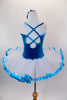 Teal velvet ballet tutu dress with beaded applique has attached white tulle bottom with teal ribbon edge Back has a design of looping cross straps. Comes with matching floral hair accessory. Back