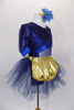 Navy blue, open backed dress has lace overlay with mesh center & pouf sleeves. Skirt is navy tulle with attached shorts. Comes with  gold apron & hair accessory. Side