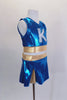Two piece turquoise & gold cheerleader themed costume has large crystaled “K” at the front & peek-a-boo hole at the back. Comes with matching pleated skort. Side