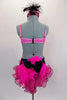 Pink & black velvet polka dot costume has mesh skirt & matching bust area. The black mesh torso has pink crystaled banding. Back has velvet bow & pink feathers. Comes with matching hat accessory, Back