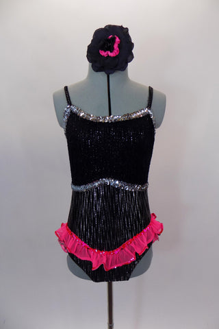 Black  speckled jazz-cut, camisole leotard has lace covered bust area edged with silver sequin. Bright pink sequined edged ruffle dips across the front & back. Has matching hair accessory. Front