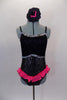 Black  speckled jazz-cut, camisole leotard has lace covered bust area edged with silver sequin. Bright pink sequined edged ruffle dips across the front & back. Has matching hair accessory. Front