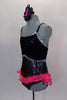 Black  speckled jazz-cut, camisole leotard has lace covered bust area edged with silver sequin. Bright pink sequined edged ruffle dips across the front & back. Has matching hair accessory. Side