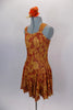 Flowy, glitter tank stretch dress has wide shoulder straps & gathered front bodice. Base is burnt orange with amber leaves & berries and gold fleck. Comes with matching hair scrunchie. Side