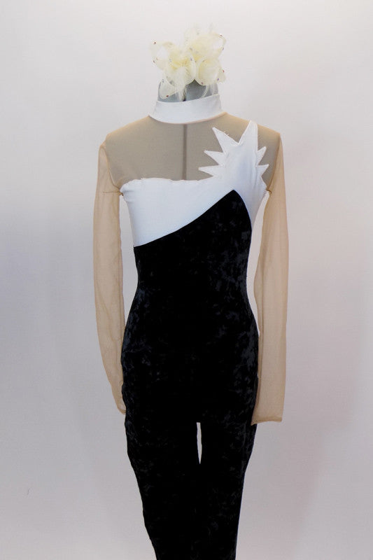 Black crushed velvet unitard has long sleeved nude mesh upper & white pleather bust area with  unique design resembling an explosion that dips into a V at back. Front