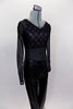 Black faux leather straight leg pant is accompanied by a black sheer long sleeved leotard with a black & silver sparkle racer-back bra. Comes with hair barrette. Side