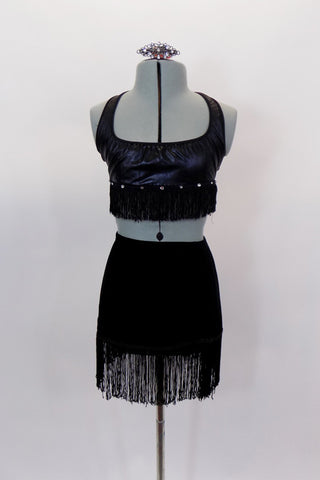 Black faux leather halter bralette is lined at with crystals & black fringe. Matching black velvet pull-on skirt has black fringe edge & has a separate panty. Comes with hair accessory. Front