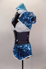 Aqua blue sequined shrug jacket covers a white bra top & separate faux shirt collar with attached black neck tie. The sequined skort has side slits. Comes with matching hat. Side