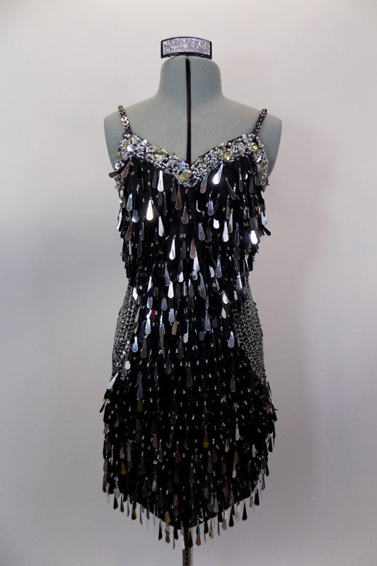 Ultimate flapper dress is black and silver covered entirely in dangling teardrop paillette sequins with beaded banding & circular side pattern of beading. Comes with hair accessory. Front
