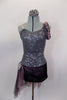 Pewter sequined camisole one shoulder dress has skirt with side-back bustle in ruffled layers of charcoal & blush mesh. Has jeweled hip accent & hair accessory. Front