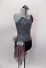Pewter sequined camisole one shoulder dress has skirt with side-back bustle in ruffled layers of charcoal & blush mesh. Has jeweled hip accent & hair accessory. Right side