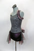 Pewter sequined camisole one shoulder dress has skirt with side-back bustle in ruffled layers of charcoal & blush mesh. Has jeweled hip accent & hair accessory. Left side