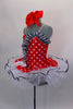 Red & white polka dot tutu dress has white tutu base with black sequin edge. Has black & white striped ruffle across sweetheart bodice. Comes with hair bow.  Left side