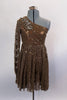 Pale brown sequined lace dress has one shoulder and long sleeve that rests over a lined copper leotard. There is a large beaded applique that sits along right shoulder and bust. Comes with matching hair accessory. Front