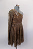 Pale brown sequined lace dress has one shoulder and long sleeve that rests over a lined copper leotard. There is a large beaded applique that sits along right shoulder and bust. Comes with matching hair accessory. Right side