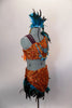 2-piece native inspired costume is  orange sequined with teal feathers. Bra  has an asymmetrical shoulder & tie-up sides. Comes with feather trimmed skirt. Right side