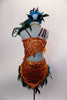 2-piece native inspired costume is  orange sequined with teal feathers. Bra  has an asymmetrical shoulder & tie-up sides. Comes with feather trimmed skirt and feather hair accessory. Back