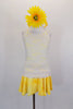 Two piece crystaled costume has yellow crepe pull-on skirt with attached white briefs. The matching camisole top is a yellow base beneath white stretch lace.  Comes with floral headband accessory. Front