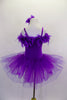 Purple velvet camisole tutu dress has layers of wide pleated organza skirt. The bust is lined with thick purple boa feathers. Comes with feather hair accessory. Back